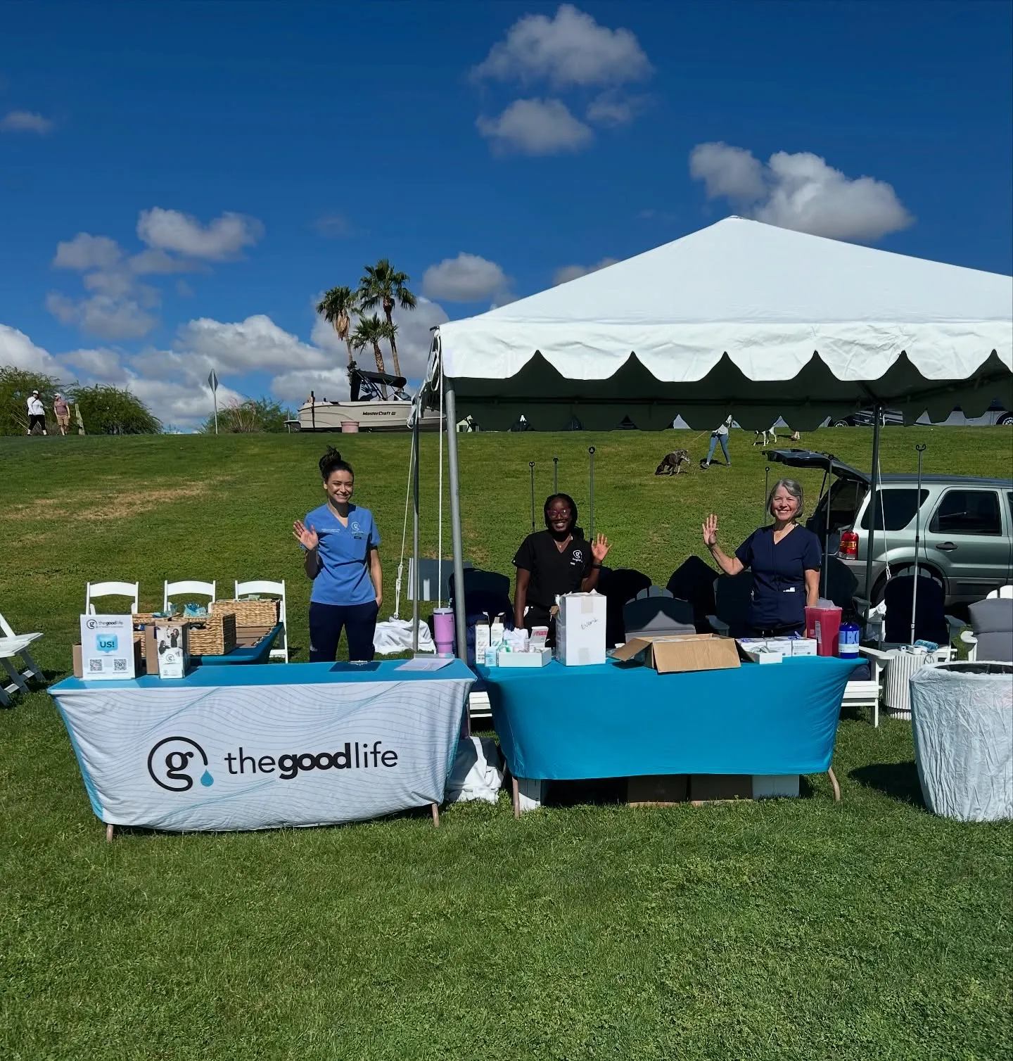 The Good Life IV table under a tent at an outdoor event