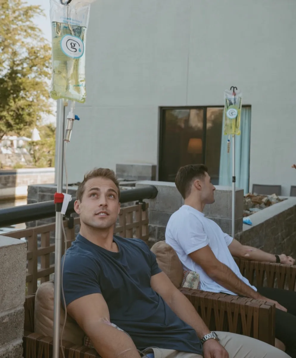 Two friends with their IVs on a patio