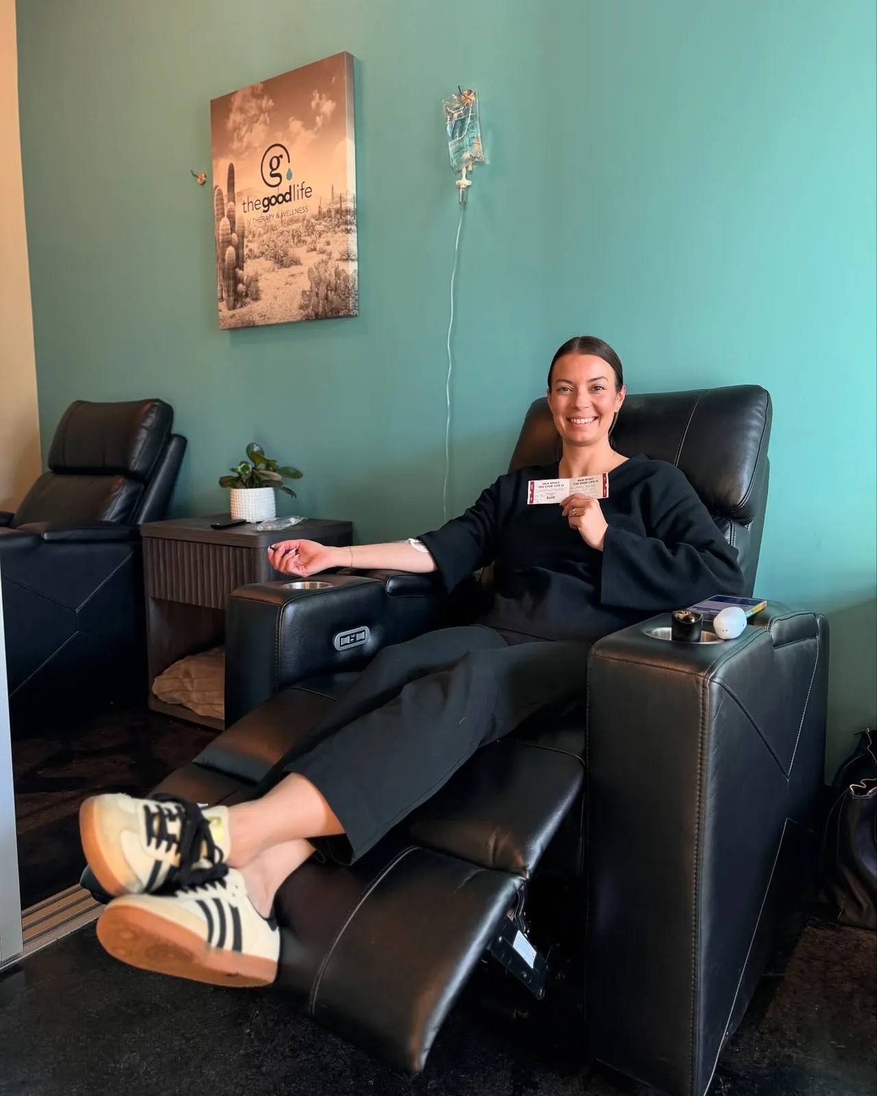 A client in a studio chair with an IV